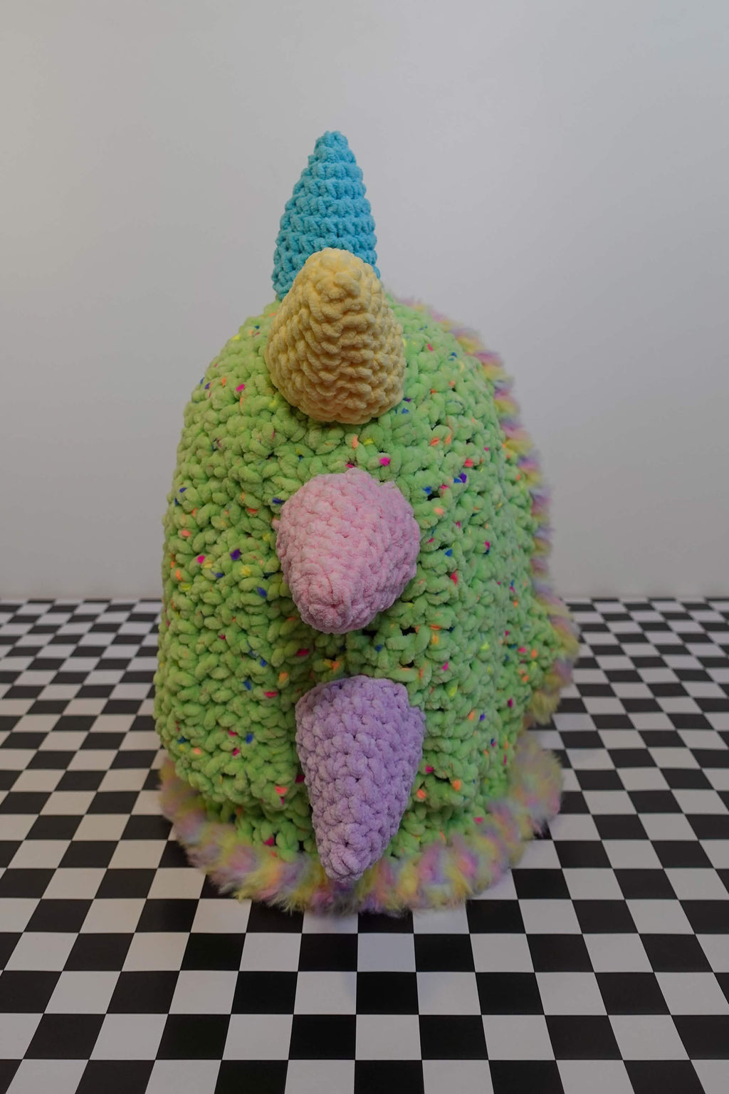 Handmade crochet pastel rainbow dino rave hood with plush spikes and faux-fur trim – Knotty Things