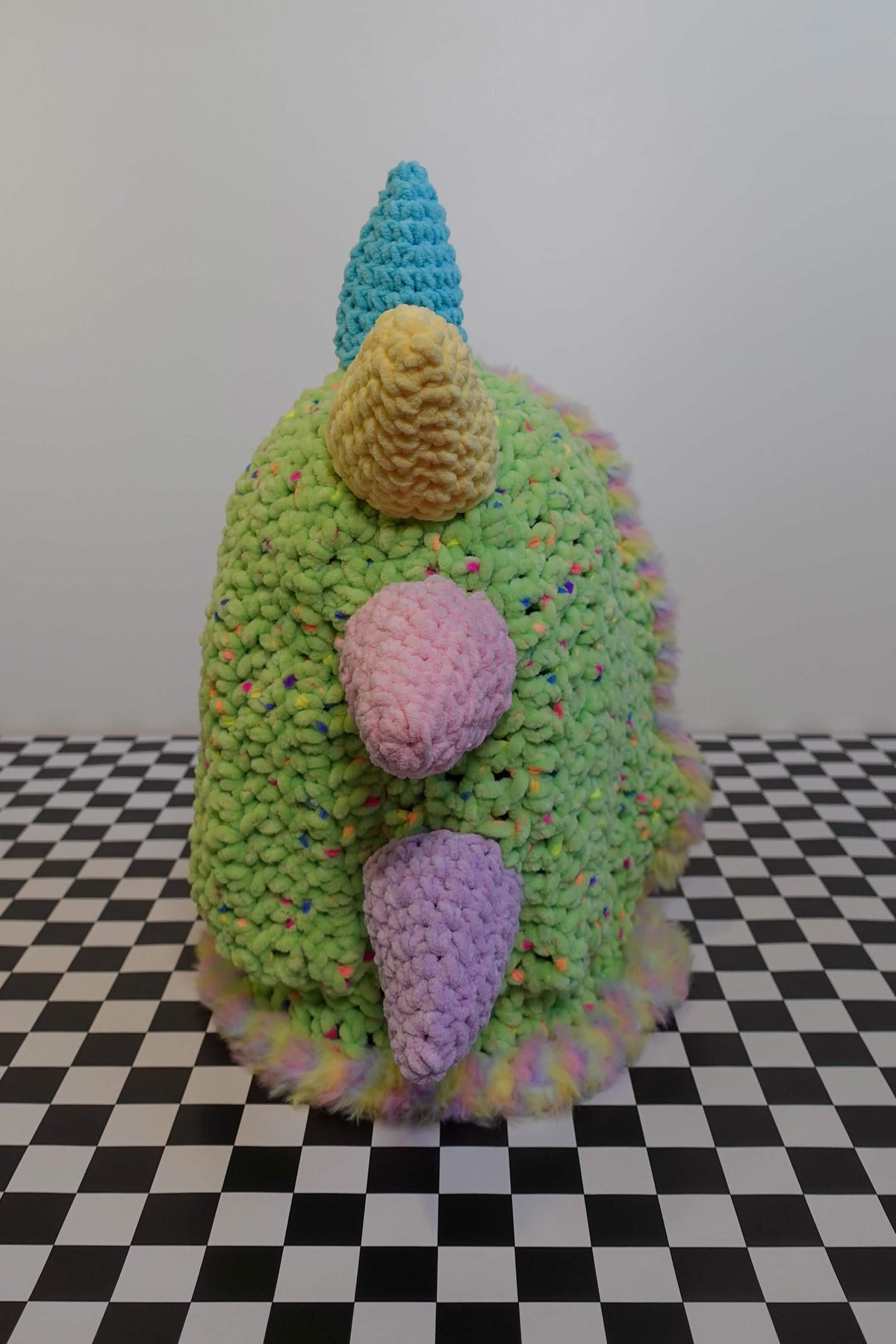 Handmade crochet pastel rainbow dino rave hood with plush spikes and faux-fur trim – Knotty Things