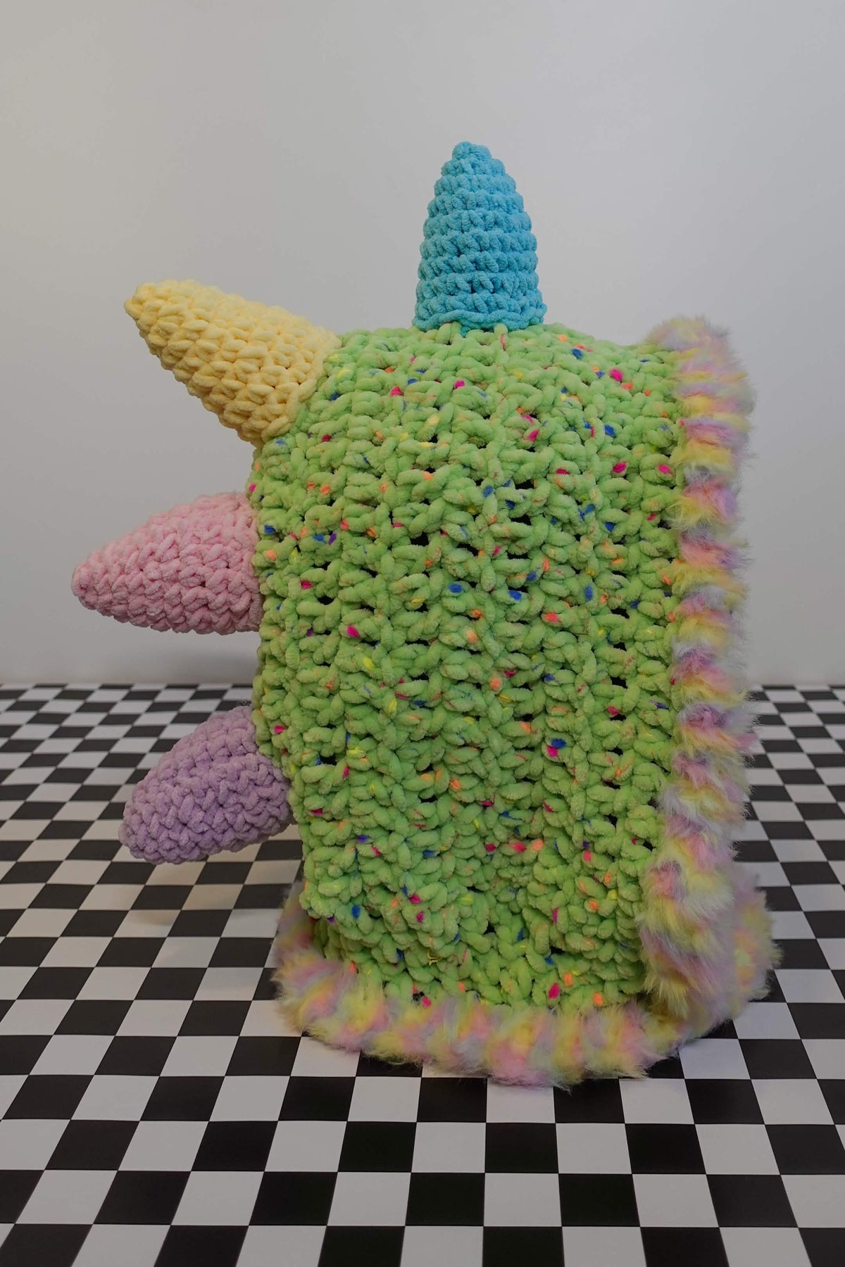 Handmade crochet pastel rainbow dino rave hood with plush spikes and faux-fur trim – Knotty Things