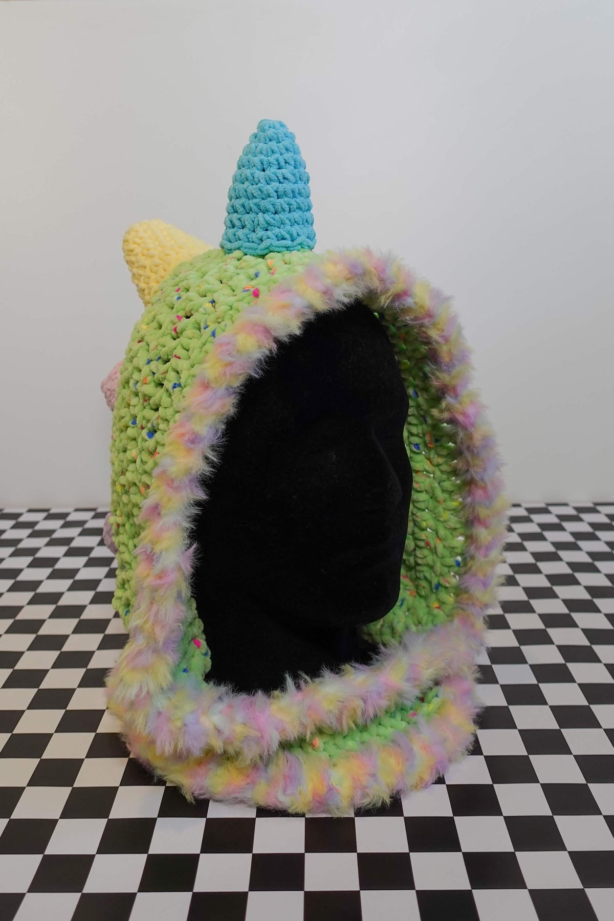 Handmade crochet pastel rainbow dino rave hood with plush spikes and faux-fur trim – Knotty Things