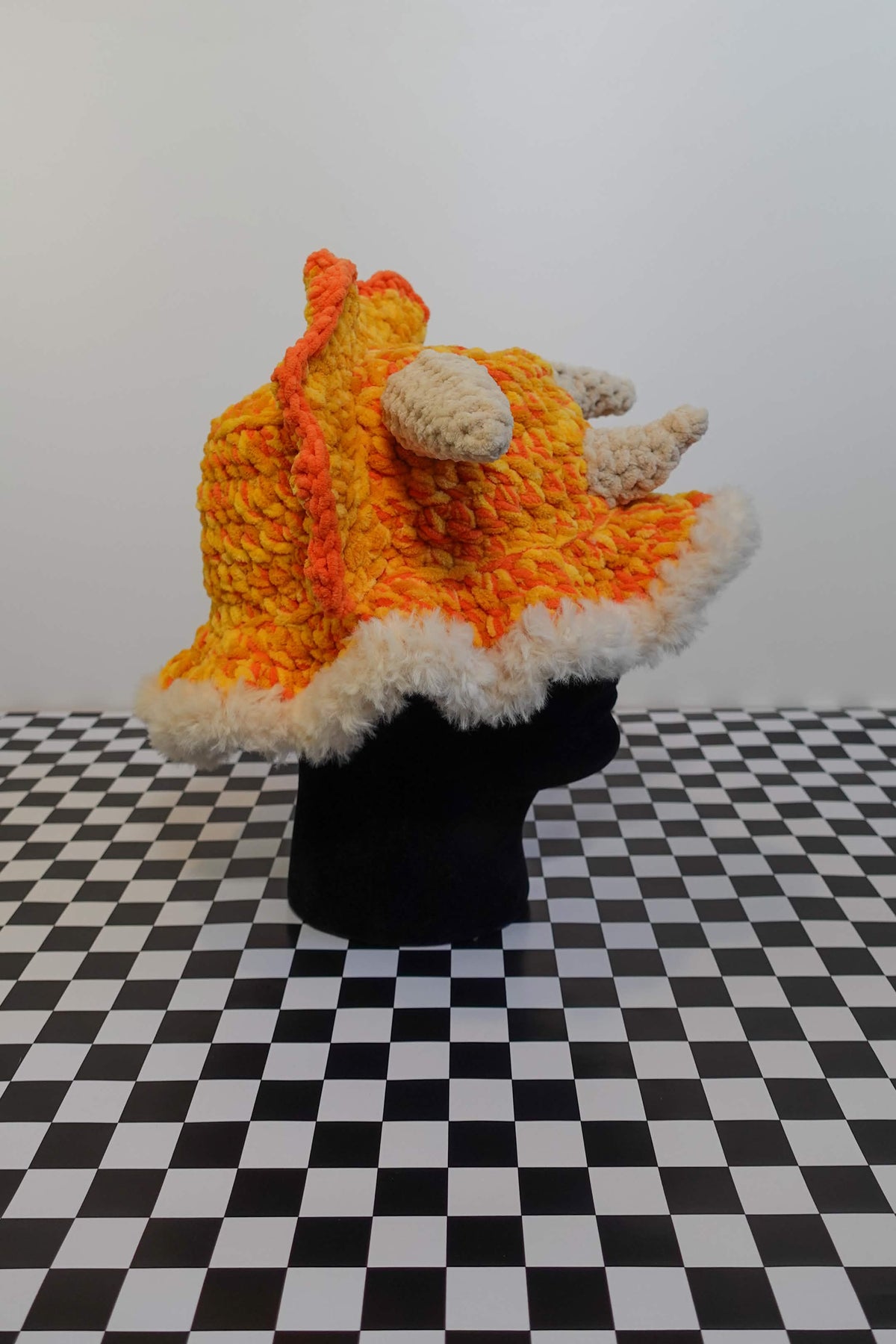 Handmade crochet triceratops bucket hat with plush horns and frill – Knotty Things